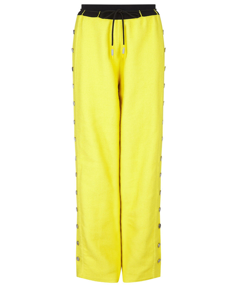 TROUSERS WITH SIDE BUTTONS IN YELLOW - THE BOX BOUTIQUE