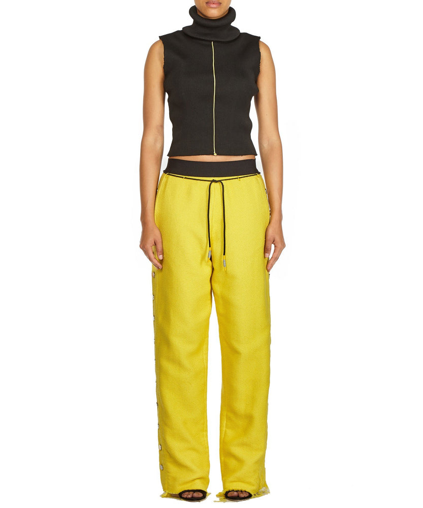 TROUSERS WITH SIDE BUTTONS IN YELLOW - THE BOX BOUTIQUE