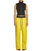 TROUSERS WITH SIDE BUTTONS IN YELLOW - THE BOX BOUTIQUE