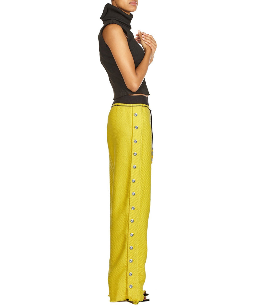 TROUSERS WITH SIDE BUTTONS IN YELLOW - THE BOX BOUTIQUE