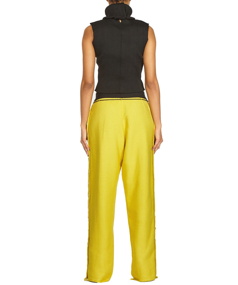 TROUSERS WITH SIDE BUTTONS IN YELLOW - THE BOX BOUTIQUE
